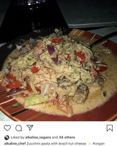 a red plate topped with food on top of a table