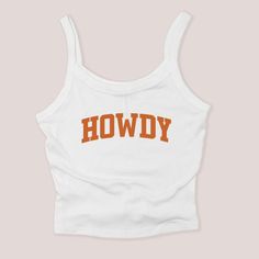 This trendy Howdy micro rib tank is a must-have in any Texan's wardrobe. Show off your state pride with the classic "Howdy" slogan featured on this exclusive Texas collection shirt. Perfect for a casual day out or a game day outfit. .4 oz./yd², 52/48 Airlume combed and ring-spun cotton/polyester, 32 singles Athletic Heather is 90/10 Airlume combed and ring-spun cotton/polyester Pre-shrunk Fitted Side seams RETURNS & EXCHANGES : These items are NON returnable as we print on demand. Due to the custom printing, we are unable to return or exchange. If you have any questions at all before ordering, please call, live chat, or email us! We are sure you will love your items. Texas Game Day Outfit, Texas Shirt, Brides Babes, Texas Shirts, Unique Sweatshirt, Game Day Outfit, Pet Mom, Bridal Shower Welcome Sign, Cowboy Cowgirl