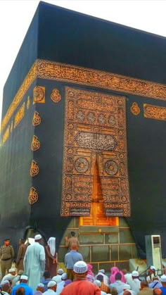 the entrance to the ka'bah with many people standing around and looking at it