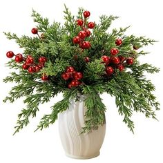 a white vase filled with red berries and greenery