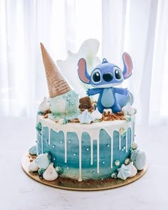 a birthday cake decorated with an image of stitchy from lilpui and ice cream drizzles