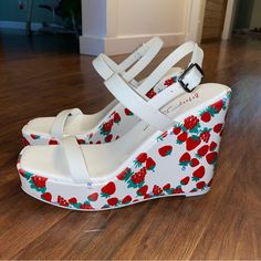 Brand New Strawberry And Berry Patterned Wrap Wedge Heel. -4.5’ Heel, 1” Platform -Open Toe -Ankle Buckle Closure Color: White/Red Berry Print High Heel Synthetic Wedge Sandals With Red Sole, White Heels With Red Sole For Spring, Spring Wedge Sandals With Red Sole, Spring Wedge Heels With Red Sole, Trendy White Wedge Sandals, Strawberry Heels, Strawberry Shoes, Betsey Johnson Sandals, White Wedge Sandals With 4-inch Heel For Spring