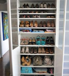 a closet filled with lots of shoes and purses