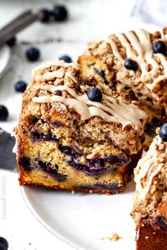 a blueberry coffee cake cut into slices on a plate