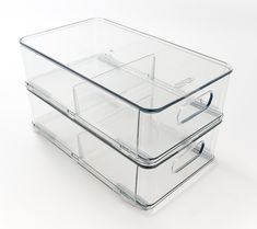 two clear plastic containers sitting on top of each other