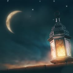 a lantern lite up in the night sky with a crescent moon and stars behind it