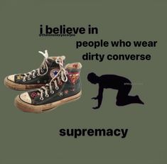 a person standing next to a pair of shoes with the caption, i believe in people who wear dirty conversee