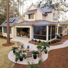 a house with lots of plants in the front yard