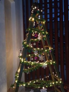 a christmas tree with lights and decorations on it