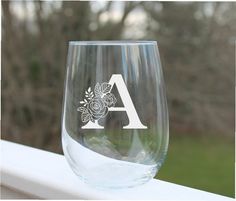 a wine glass sitting on top of a window sill