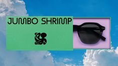 a pair of sunglasses sitting on top of a sign that reads junobo shrimpp