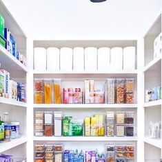 an organized pantry with clear bins and lots of food on the shelves, including cereal