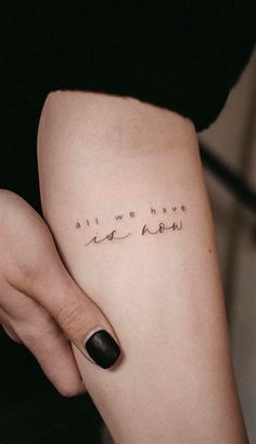 a woman's leg with the words all we have is love tattooed on it