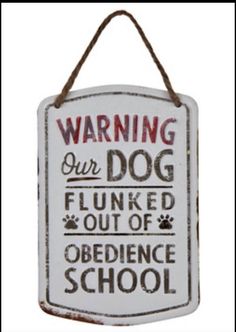 a sign that says warning our dog is flunked out of obedience school