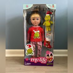 the doll is in its box on the floor