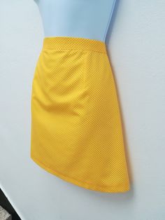 "NOELLE SKIRT Handmade skirt 65% Polyester 35% cotton Color: yellow This skirt is also available custom made! We need to know: waist, hips, length Sizes XS: CHEST 84 CM / WAIST 66 CM / HIPS 90 CM S: CHEST 88 CM / WAIST 70 CM / HIPS 94 CM M: CHEST 92 CM / WAIST 74 CM / HIPS 98 CM L: CHEST 96 CM / WAIST 78 CM / HIPS 102 CM XL: CHEST 100 CM / WAIST 82 CM / HIPS 106 CM XXL: CHEST 104 CM / WAIST 86 CM / HIPS 110 CM *Notice that the pictures are made by professionals and prepare for the best look on t Fitted Retro Style Mini Skirt, Retro Fitted Short Skirt, Retro Cotton Mini Skirt, Fitted Polka Dot Skirt With Lining, Fitted Polka Dot Mini Skirt, Yellow Retro Skirt With Relaxed Fit, Retro Fitted Mini Skirt With Lining, Fitted Retro Cotton Mini Skirt, Retro Fitted Cotton Skort