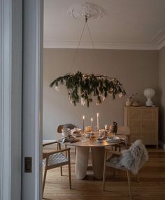 a dining room table with candles on it