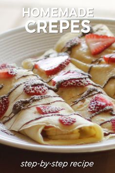 homemade crepes on a plate with strawberries