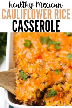 mexican cauliflower rice casserole in a white dish with a wooden spoon