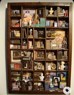 a wooden book shelf filled with lots of books