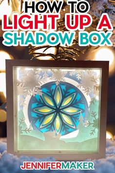 a shadow box with snowflakes on it and the title how to light up a shadow box