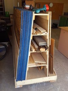 a wooden shelf filled with different types of wood