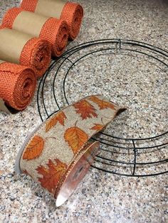 three rolls of toilet paper sitting on top of a counter next to a towel rack