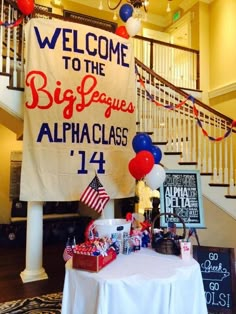 an image of a birthday party with balloons and decorations on the table in front of stairs