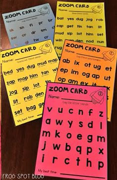 four different types of zoom cards sitting on top of a wooden table next to each other