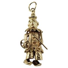 9 Karat Yellow Gold Articulated Clown Charm- This jolly clown charm is completely articulated with moving head, arms and feet! Meticulously crafted in 9K yellow gold. Sure to bring a smile to your face! Stamped: .375 Size: 31 mm x 10 mm Weight:  3.6 dwt. / 5.7 gr. Very good condition, professionally polished. Will come packaged in a gift box or pouch (when possible) and will be shipped U.S. Priority Mail Insured. DV091624/17KCS Vintage Gold Charms, Articulated Fish, Vintage Charm Bracelet, Gold Charms, Auction Items, Vintage Bracelets, Gold Charm, Vintage Charms, Vintage Gold