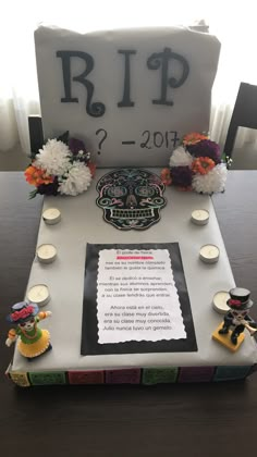 a decorated table with candles, flowers and a sign on it that says rip 2 - 2013