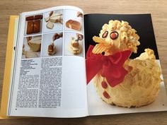 an open book with pictures of food in the shape of a chicken and other foods