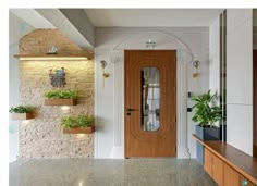 an entryway with potted plants on the wall and a wooden door in the center