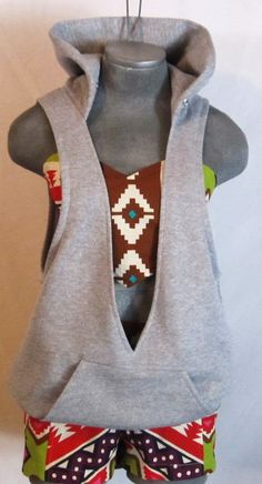 a gray sweater vest with colorful print on it