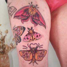 a woman's legs with tattoos and butterflies on them