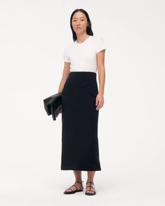 Classic, understated, and versatile - the Tube Skirt has a slim, body-gracing fit whose length can be adjusted by lifting, lowering, or folding the elasticated waist. For elevated casual, pair with the T-Shirt. This custom fabric features a premium organic cotton expertly knit together with lyocell. The lyocell in this Versatile Fitted Cotton Skirt, Versatile Cotton Skirt For Work, Fitted Classic Maxi Skirt For Workwear, Fitted Modern Lined Maxi Skirt, Modern Fitted Lined Maxi Skirt, Fitted Modern Maxi Skirt With Lined Skirt, Modern Fitted Maxi Skirt For Spring, Versatile Fitted Long Skirt, Classic Fitted Cotton Pencil Skirt