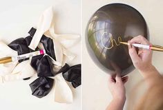 a woman is writing on a balloon and it has black ribbon around the balloon with gold lettering