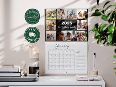 a desk with a calendar, potted plant and other items on top of it