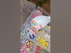 a plastic container filled with lots of different types of beads