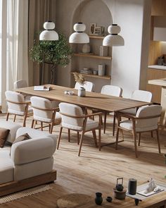 a living room filled with furniture and a wooden table in front of a large window