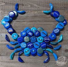 a crab made out of blue bottle caps