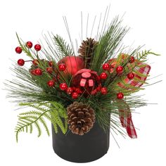 a christmas arrangement in a black pot with pine cones, berries and other holiday decorations