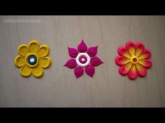 three different types of flowers on a wooden surface with text that reads, how to make paper flowers