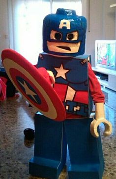 a lego captain america character holding a shield