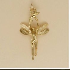 Gold Plated Fairy with Star Charm Pendant 1 1/4 inch, 31mm (Chain not included, for illustration only) LIFETIME REPLACEMENT GUARANTEE We will replace your item if it breaks during normal wear GOLD PLATING GUARANTEE If, in the rare event, the gold plating wears off, we will re-plate it for free The gold plating is 22 Karat over 925 sterling silver. Sterling Silver Chains ... https://www.etsy.com/listing/1340663831/sterling-silver-rope-chain-drawn-flat Gold Filled Chains ...  https://www.etsy.com/listing/1328079176/gold-filled-rope-chain-drawn-flat-cable CHAINS ARE NOT RETURNABLE EARRINGS Checkout 2 charms to place an order for a pair of earrings.  Message me at checkout that you would like earrings, or via Etsy convo after checkout.  There is a $4 re-stocking fee for returned earrings. Silver Fairy, Diy Jewelry Rings, Fairy Charms, Silver Chains, Jewelry Lookbook, Fantasy Jewelry, Boyfriend Girlfriend, Pretty Jewellery, Star Charms