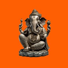 an elephant statue sitting in front of an orange background