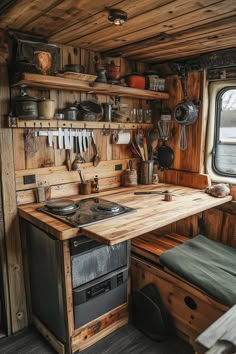 a kitchen with wooden walls and shelves filled with cooking utensils