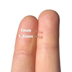 two fingers are shown with the measurements for each finger and one has a diamond on it