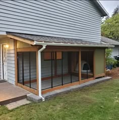 a house with a porch and screened in area