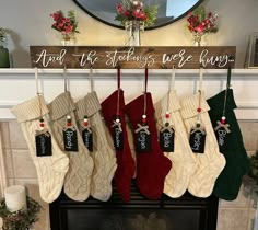 stockings hanging from a fireplace mantel in front of a sign that reads and the stockings were hung